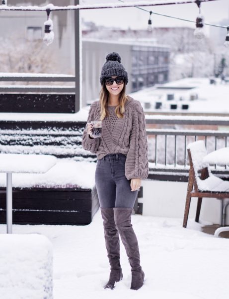 express grey chenille sweater with grey beanie on snowy rooftop