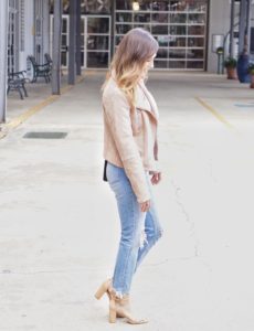 blush members only moto jacket with ripped denim and nude sandals
