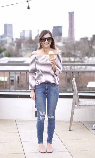 style blogger holding jeni's ice cream cone on rooftop