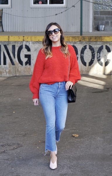mother denim with red fuzzy sweater