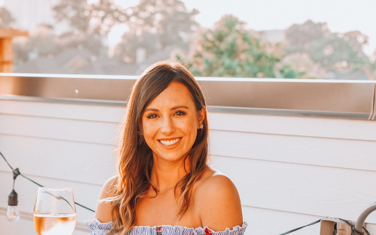 sugar lips off the shoulder dress with glass of wine