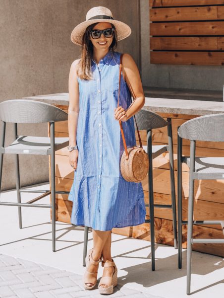 blue sleeveless button up dress with brixton hat