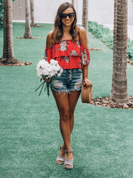 ripped denim shorts with bishop young red floral top