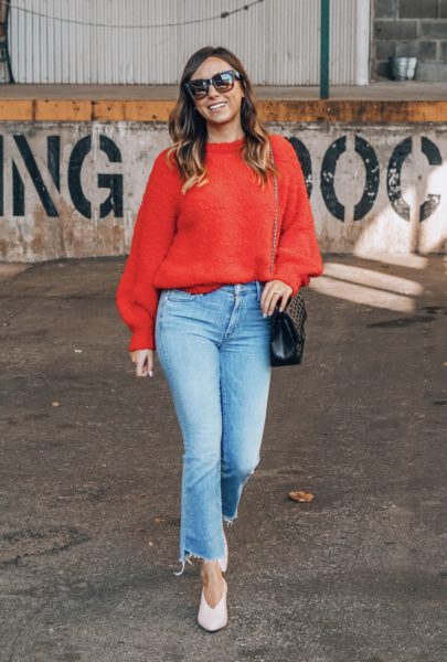 red sweater with mother denim and chanel reissue