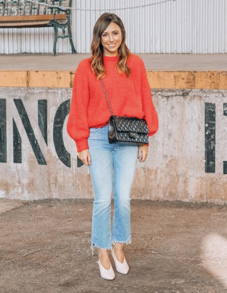 red sweater with mother denim and black chanel reissue
