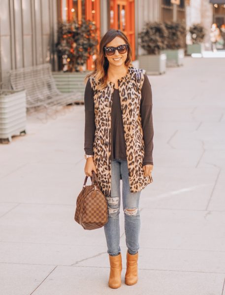 leopard vest with booties and ripped jeans