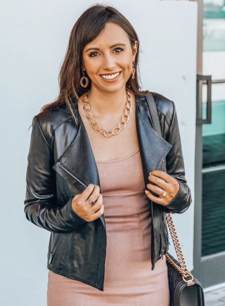 black moto jacket with bishop and young pink dress