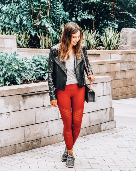 black moto jacket with red rbx leggings