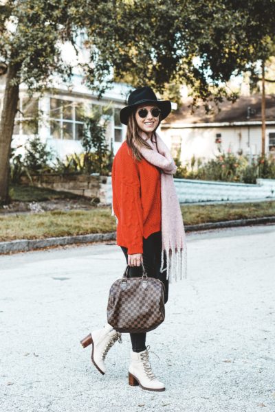 red sweater with spanx faux leather leggings