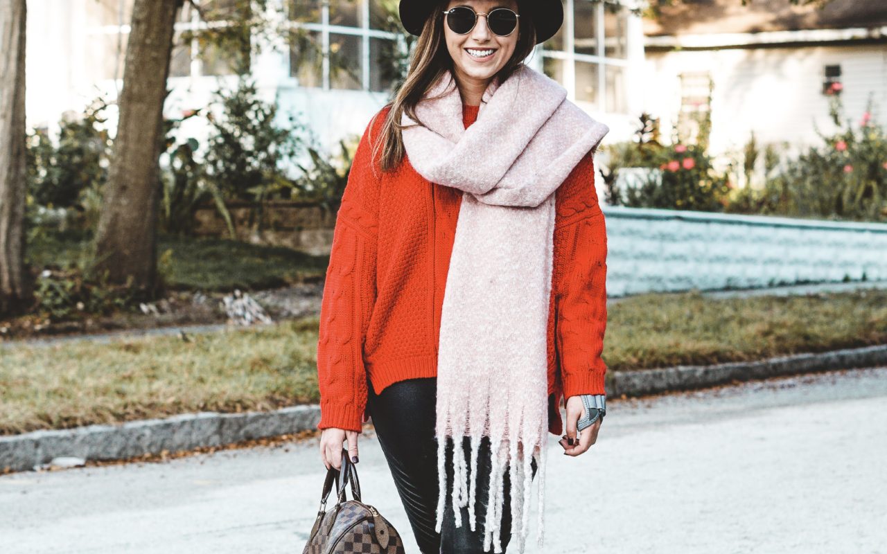 red sweater with spanx faux leather moto leggings