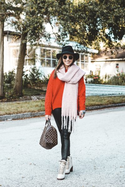 red sweater with spanx faux leather moto leggings