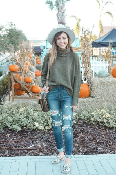 red dress olive turtleneck with ripped denim