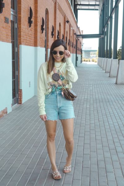 agolde dee shorts with def leppard green tee and rayban icons