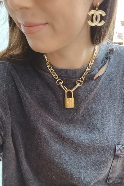 free people black rubi tee with louis vuitton lock necklace and chanel earrings