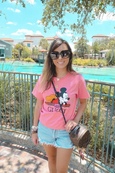 pink mickey mouse gucci tee with agolde shorts and louis vuitton palm springs mini