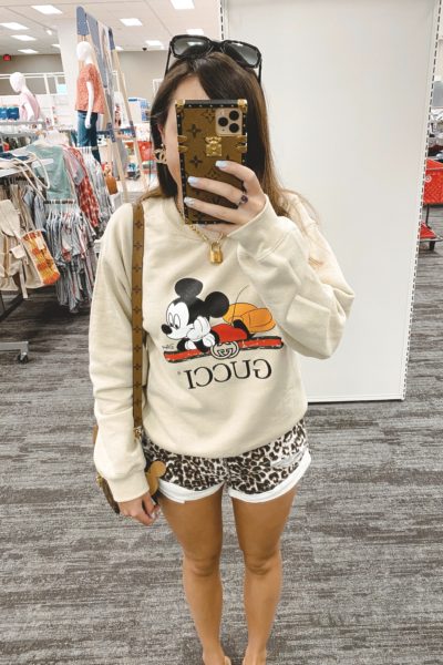 gucci disney cream sweatshirt with leopard shorts and louis vuitton lock necklace