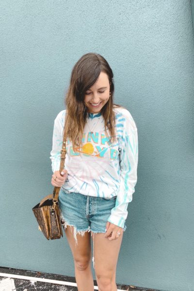 daydreamer pink floyd tie dye shirt with agolde shorts and louis vuitton pochette metis