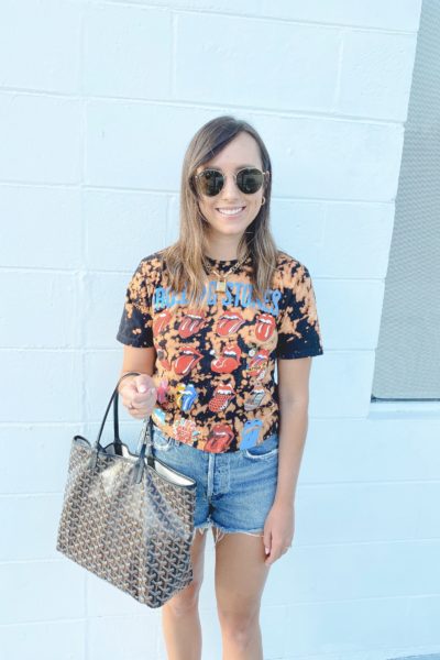 August outfit ideas bleached rolling stones tee with goyard bag and agolde shorts