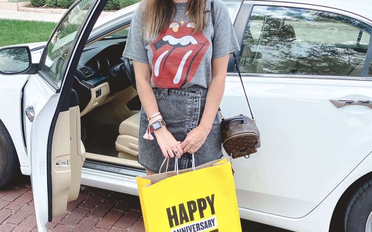 rolling stones tee with brixton hat and nsale bag