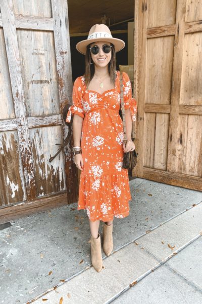 salt water luxe orange floral midi dress with tan booties and gucci headband hat