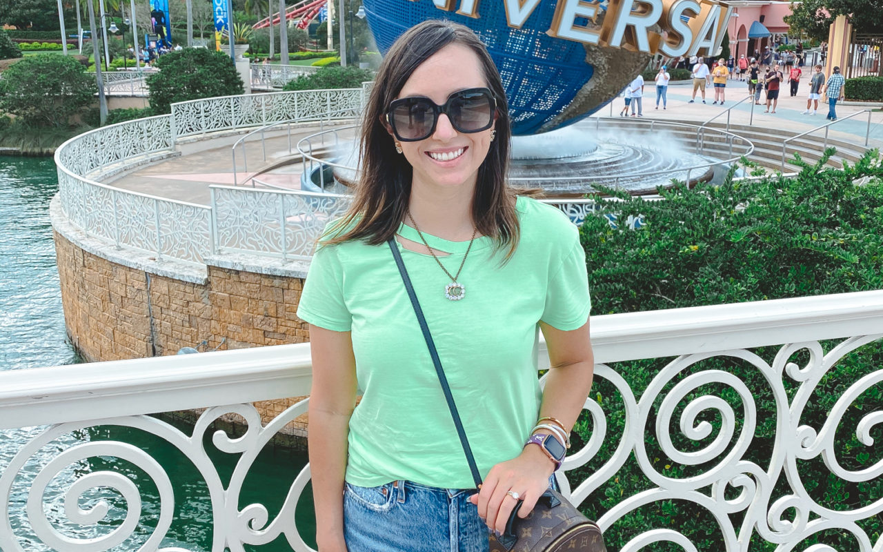 neon green tee with agolde shorts and louis vuitton palm springs at universal studios