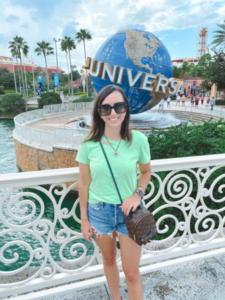 neon green tee with agolde shorts and louis vuitton palm springs at universal studios