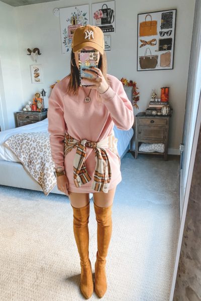 pink sweatshirt dress with tan over the knee boots and plaid flannel