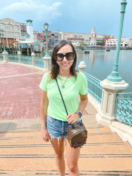 neon green tee with agolde shorts at universal studios