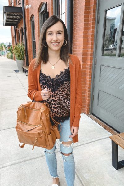 rust cardigan with leopard cami and leather backpack