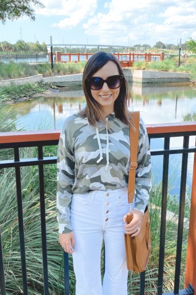 chaser camo sweatshirt with white button fly jeans and hermes evelyne