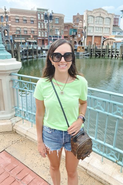 neon green distressed tee with agolde shorts at universal studios