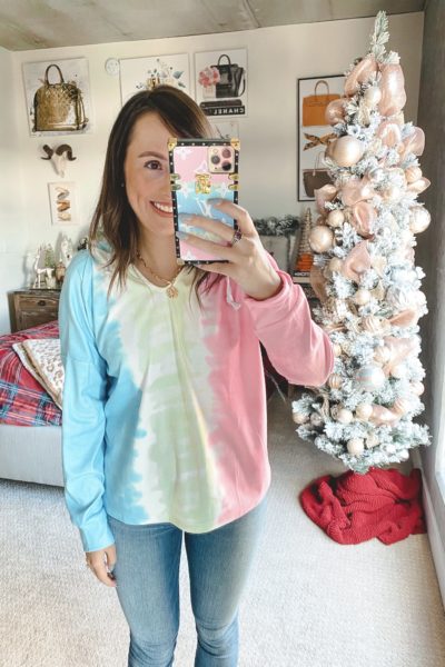 amazon tie dye sweatshirt with jeans and coin necklace