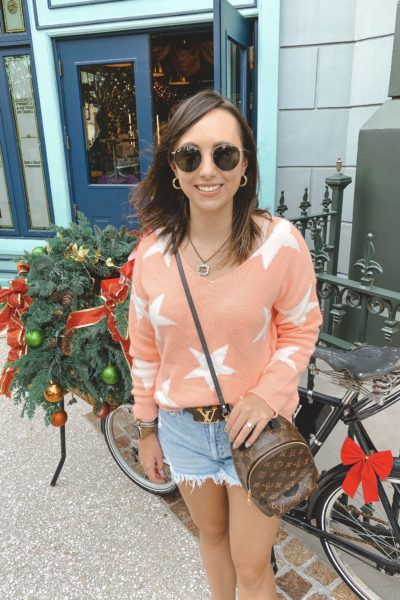 amazon star sweater with agolde denim shorts and louis vuitton palm springs mini 