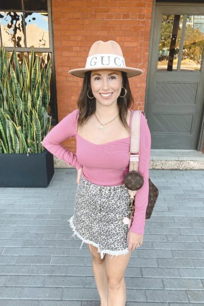 pink ribbed top with leopard mini skirt and louis vuitton multi pochette