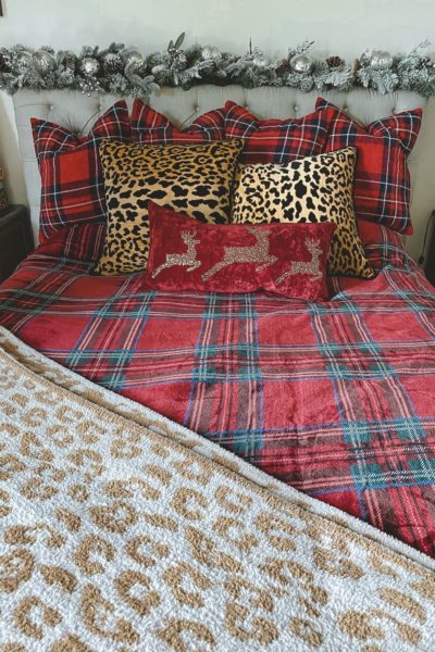 christmas bedroom decor 2020 with leopard pillows and plaid blanket