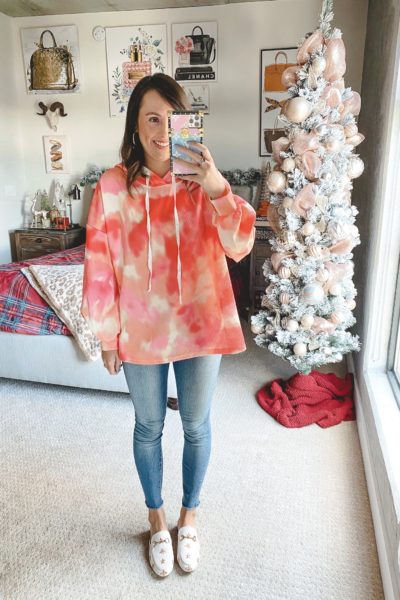 amazon orange tie dye sweatshirt with jeans and white mules