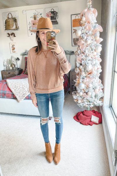 rust waffle knit with ripped jeans and marc fisher alva booties