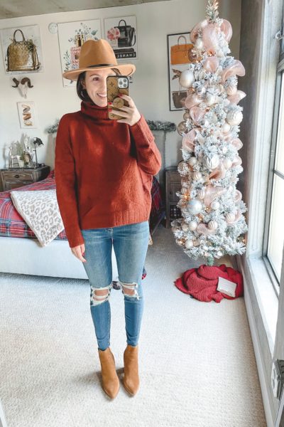 brick red turtleneck sweater with ripped jeans and marc fisher alva booties