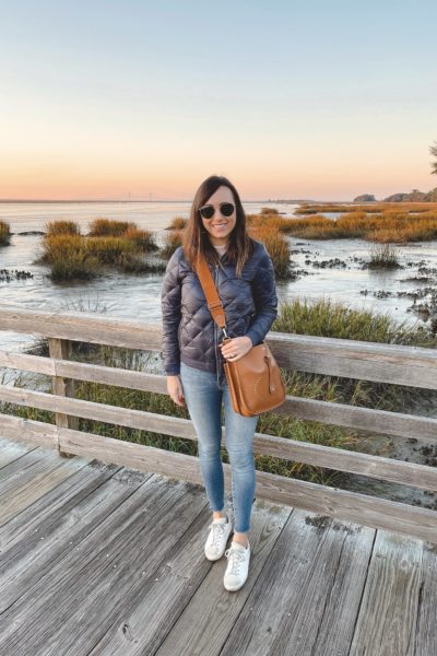 patagonia navy bomber jacket with hermes evelyne and golden goose sneakers at jekyll island