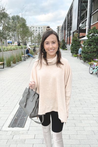 cream fleece tunic sweater with black leggings and saint laurent sac de jour