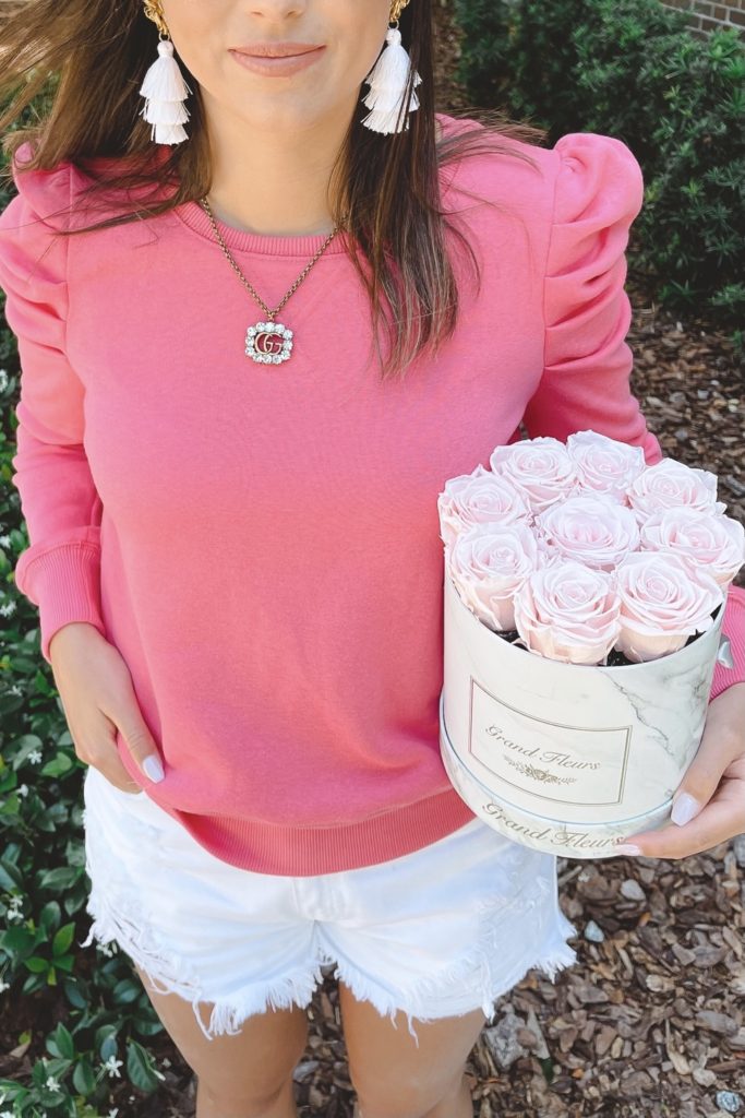 rebecca minkoff puff sleeve sweatshirt with white shorts and roses