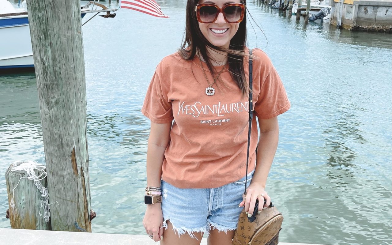 saint laurent rust tee with gucci sunglasses and louis vuitton palm springs mini