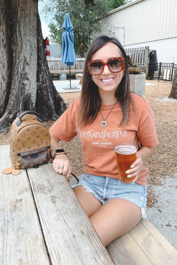 saint laurent rust tee with louis vuitton palm springs mini and gucci sunglasses