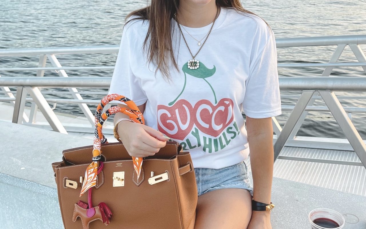 hermes birkin outfit with gucci cherry tee and gucci sunglasses