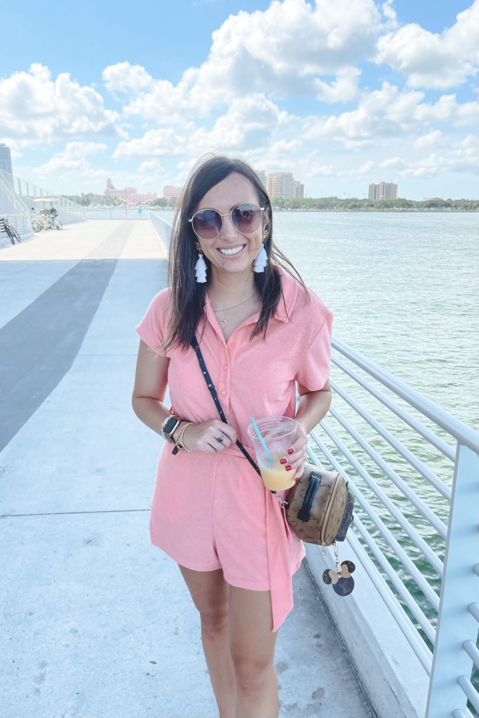lovers friends pink terry romper with gucci sunglasses and tassel earrings