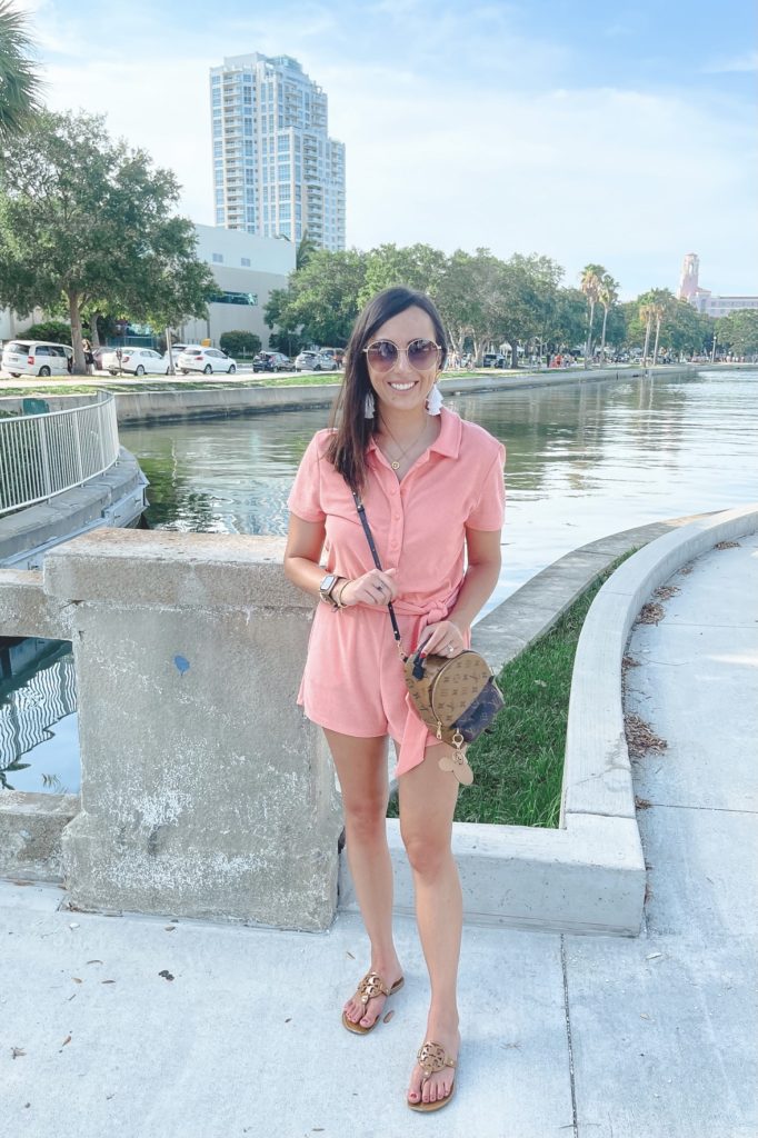 lovers friends pink romper with gucci sunglasses and tory burch sandals