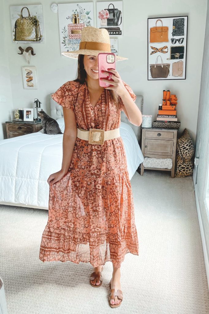 rust sleeveless floral maxi dress with raffia belt and straw hat