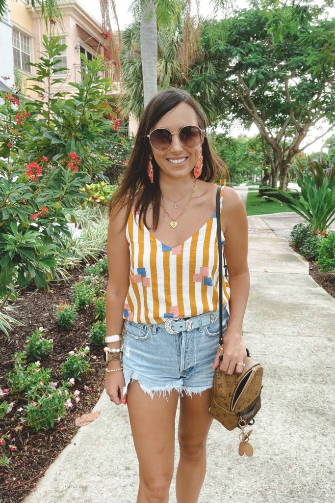 mustard stripe tank with agolde denim shorts and gucci sunglasses