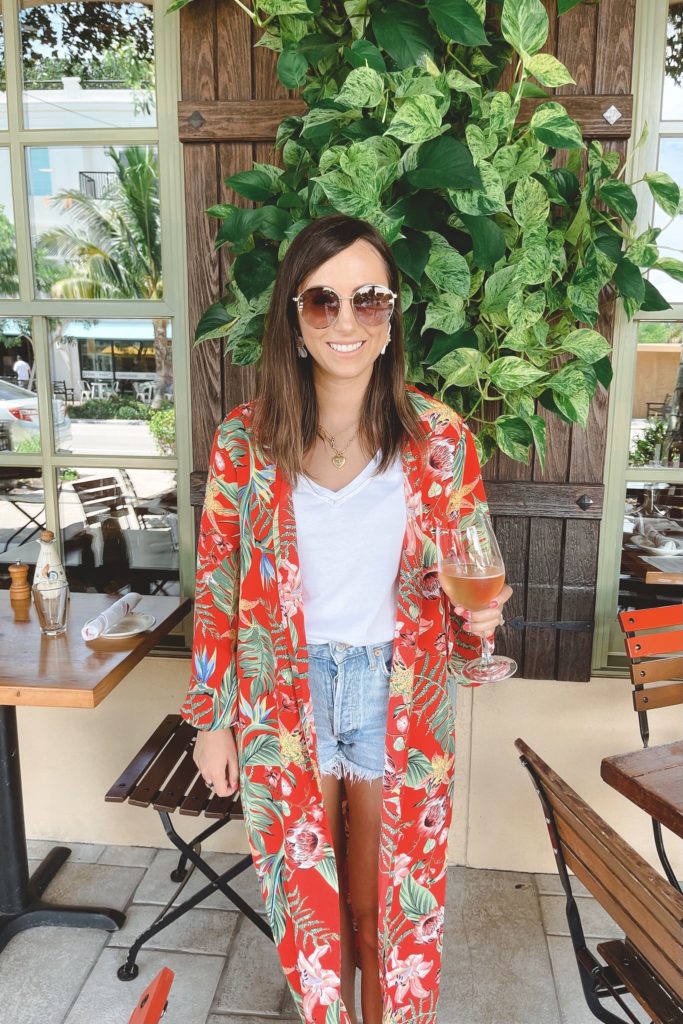 red floral kimono with white tee and denim shorts