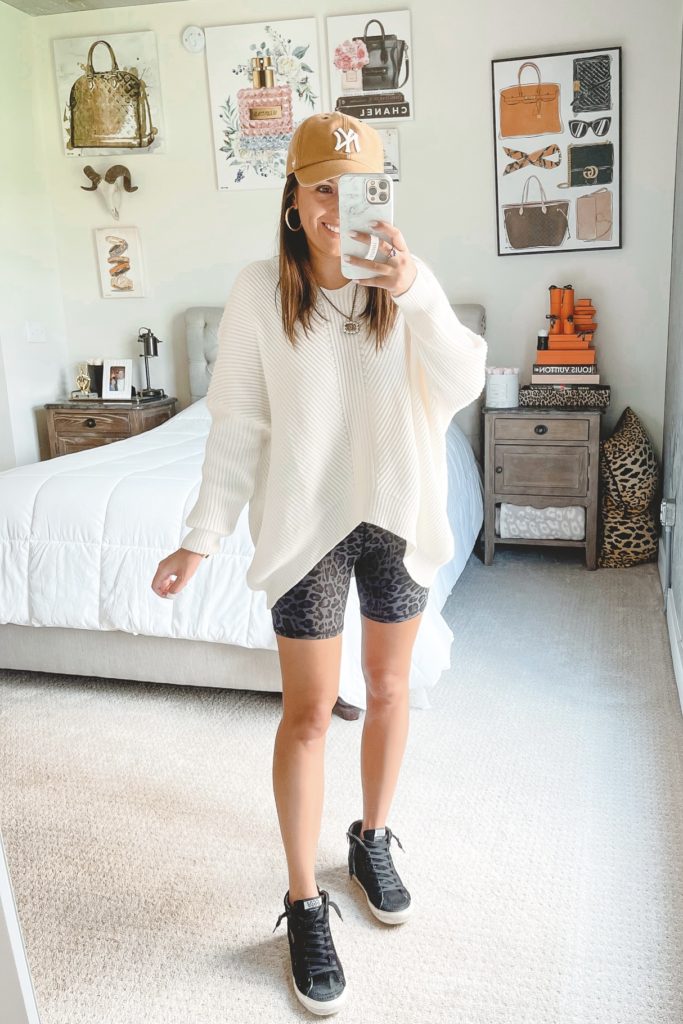 amazon white oversized sweater with leopard bike shorts and golden goose sneakers